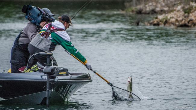 Pro Matt Arey grabs another one for the livewell on the final day of the Walmart FLW Tour on Beaver Lake.