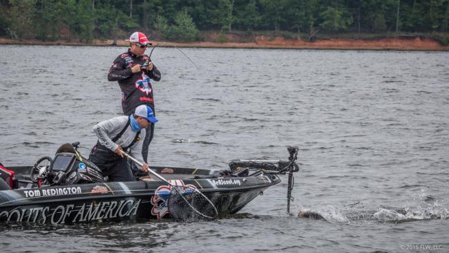 Tom Redington hauls a 4-pounder toward the boat. He ended up tossing it back because it wasn't big enough to help. 