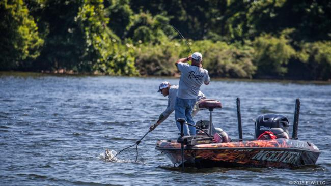Ken Ellis works a spinning-rod bass to the boat.