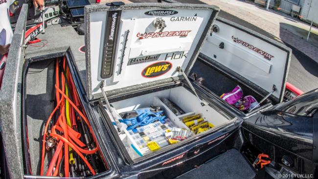 On tournament day, Brad primarily packs into the front of his boat, with rods in one locker, tackle in the two center compartments, and clothes and miscellaneous items in the second locker.