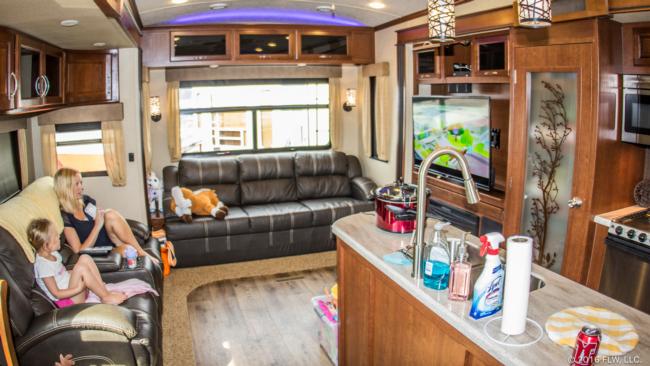 Inside, the camper offers a lot more variety than a standard hotel room. The kitchen/living area is comfortably appointed and has plenty of room for a family of three, plus one of the couches folds out so the space can double as Tinsley's bedroom. 