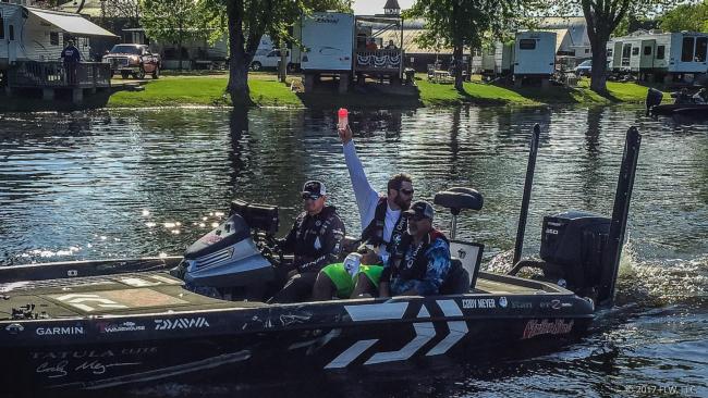 FLW Tour pro Cody Meyer heads through boat check with his team of MN Viking Brian Robison and VIP Rodney Dotson. 
